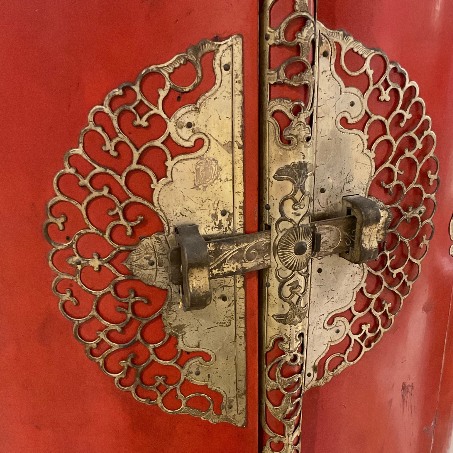 Pair antique red lacquer Gump's cabinets with original silver leaf interiors and metal hardware. Double door openings front and back. c1930s. Condition consistent with age.