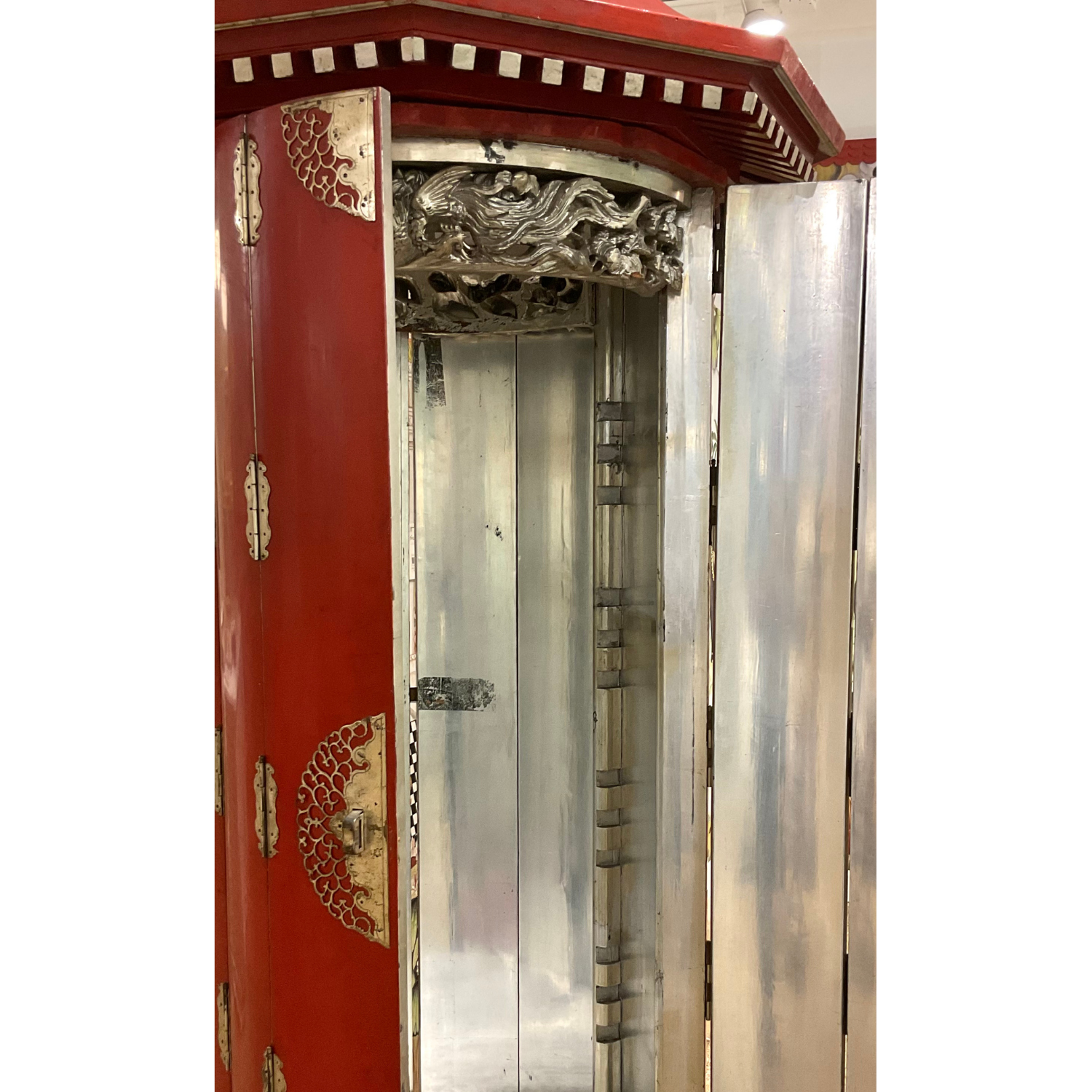 Pair antique red lacquer Gump's cabinets with original silver leaf interiors and metal hardware. Double door openings front and back. c1930s. Condition consistent with age.