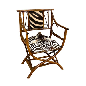 Chic antique zebra hide hair and bamboo chair.